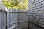 Rinse off after a hot day at the beach in the outdoor shower